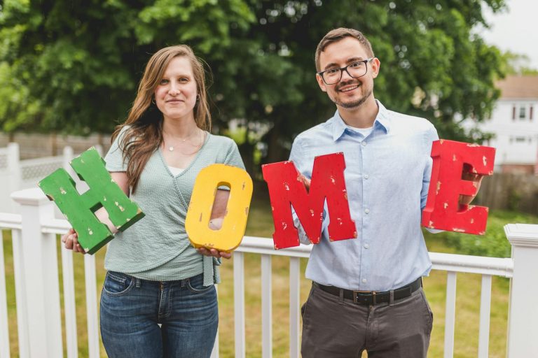 real estate agents holding letter blocks